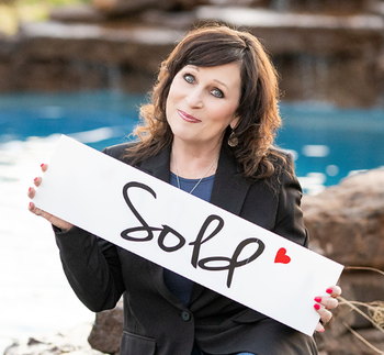 Portrait of Paula Hardee-Bellar, REALTOR®,